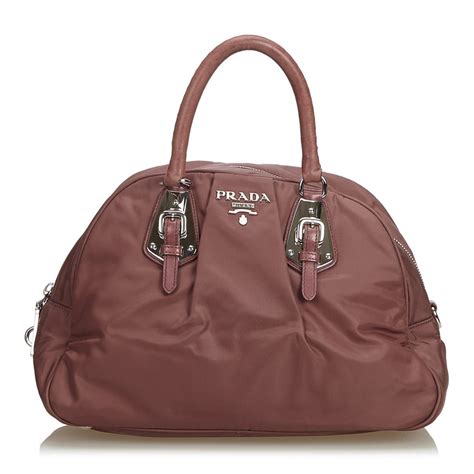 In addition, on a real bag, theres a curved notch in the letter R between the round part and the right leg and a slightly bigger space between the R and the A. . Rare vintage prada bags